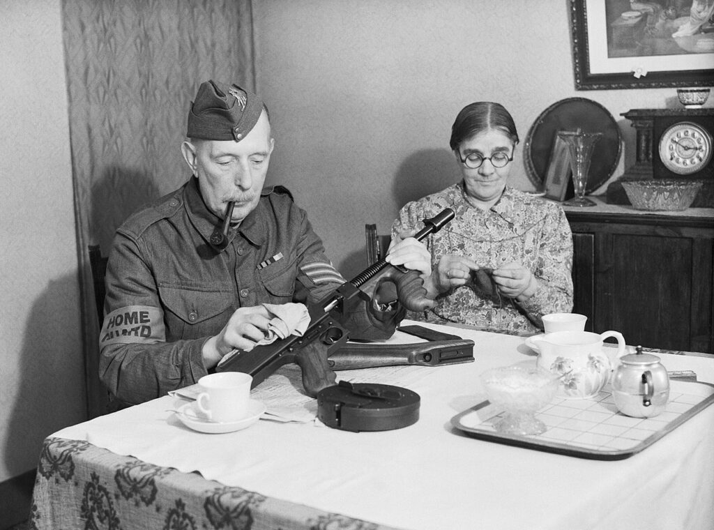 Home Guard volunteer cleaning rifle during WWII