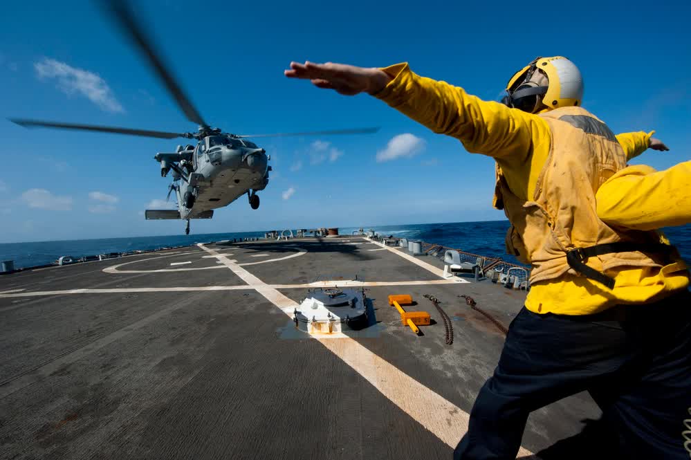 Sea Hawk helicopter landing on Arleigh Burke destroyer