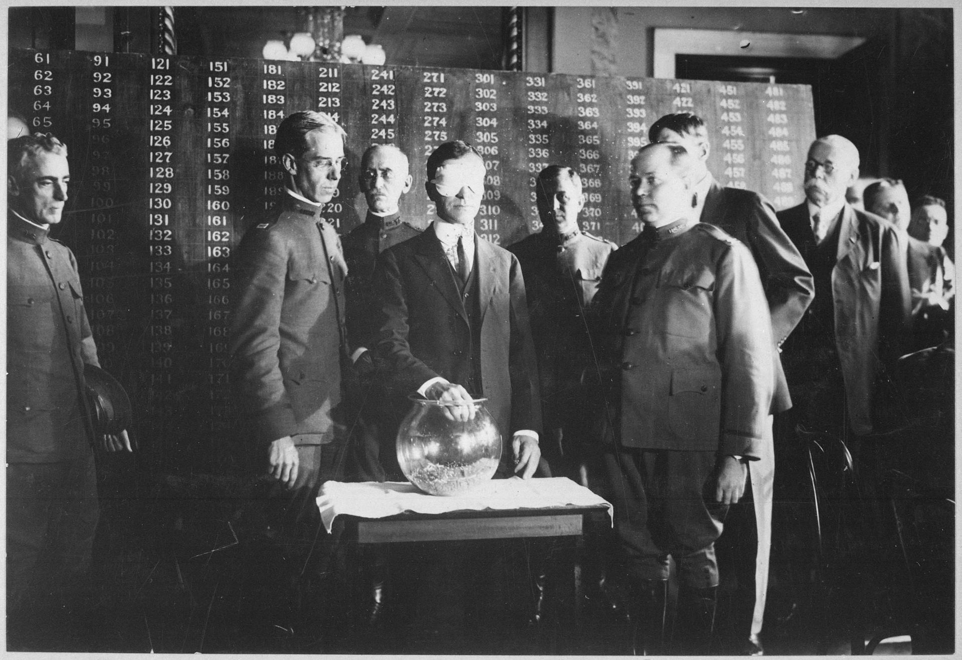 Secretary of War Newton Baker draws first draft number WWI