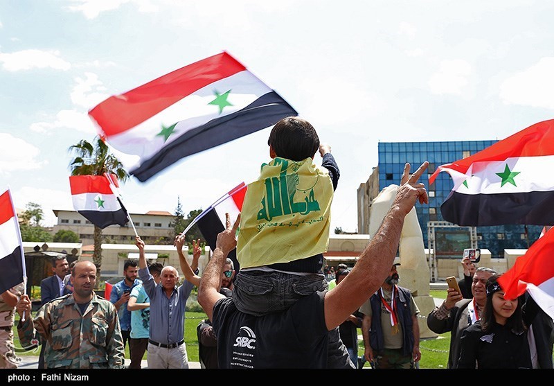 Pro-government Syrians demonstrate in Damascus