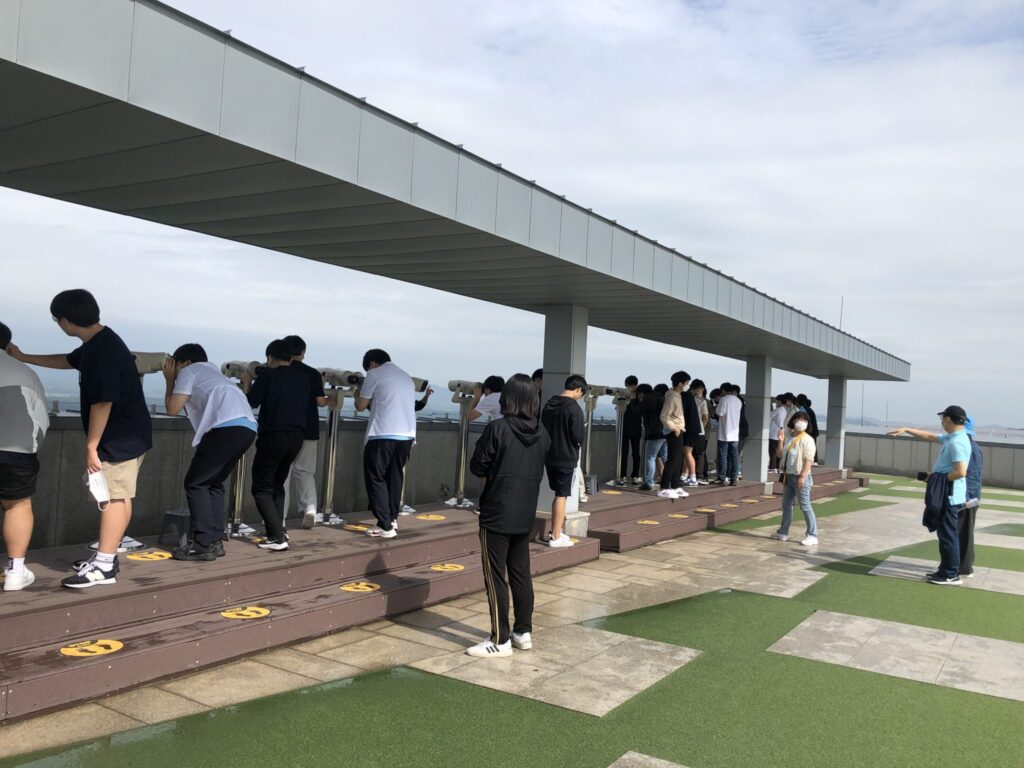 Tourist look across the border into North Korea