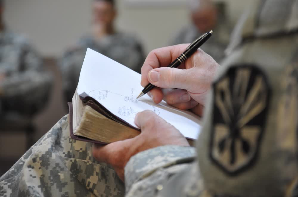 National Guard chaplain takes notes